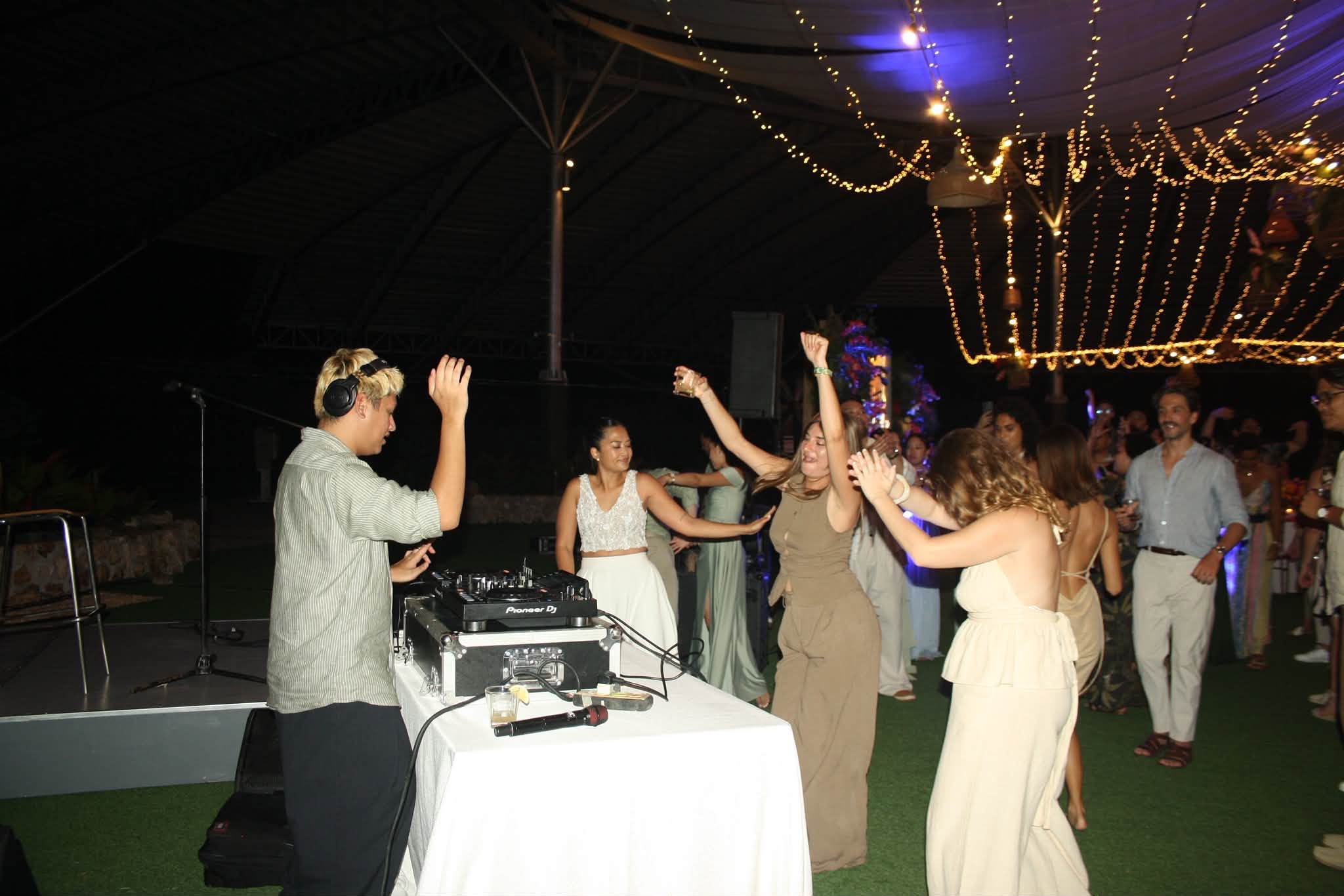 Guests dancing under string lights at a Bohol wedding